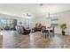 Open-concept living area with tile floors, backyard access, and lots of natural light at 3471 Julius Estates Blvd, Winter Haven, FL 33881
