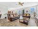 Comfortable living room featuring tile floors, lots of seating, and access to an outdoor patio at 3471 Julius Estates Blvd, Winter Haven, FL 33881