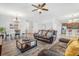 Inviting living room boasts wood-look tile flooring and an open floor plan at 3471 Julius Estates Blvd, Winter Haven, FL 33881