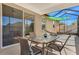 The screened patio features a seating area, table, and views of the backyard at 3471 Julius Estates Blvd, Winter Haven, FL 33881