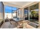 A screened-in patio with a table and chairs that offers views of the neighborhood at 3471 Julius Estates Blvd, Winter Haven, FL 33881