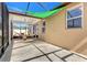 A screened-in patio with a hammock, table, and chairs, with a shade covering at 3471 Julius Estates Blvd, Winter Haven, FL 33881