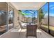 Screened patio includes seating and peaceful hammock views at 3471 Julius Estates Blvd, Winter Haven, FL 33881