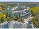 Aerial shot of clubhouse featuring rooftop terrace, multiple balconies, picnic tables and lush landscaping at 385 Southfield St, Kissimmee, FL 34747
