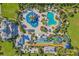Overhead shot of the water park with pools, slides, splash pad, lounge chairs, cabanas, and dining options at 385 Southfield St, Kissimmee, FL 34747