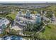 Exterior aerial image of clubhouse with wraparound balcony, outdoor seating, lush landscaping, and pool at 385 Southfield St, Kissimmee, FL 34747
