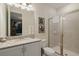 Modern bathroom with granite vanity, glass shower, and neutral decor at 385 Southfield St, Kissimmee, FL 34747