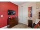 Cozy bedroom featuring a mounted TV and Harry Potter themed decor at 385 Southfield St, Kissimmee, FL 34747