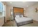 Comfortable bedroom with a luxurious bed, mirrored nightstands, and serene natural light at 385 Southfield St, Kissimmee, FL 34747