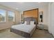 Comfortable bedroom with a luxurious bed, mirrored nightstands, and serene natural light at 385 Southfield St, Kissimmee, FL 34747