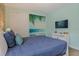 Bright bedroom with ocean-themed mural, a beachy wall and coastal decor at 385 Southfield St, Kissimmee, FL 34747