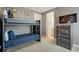 Bedroom featuring bunk bed, TV, and built in dresser at 385 Southfield St, Kissimmee, FL 34747