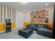 Spacious game room featuring an arcade game, movie posters and comfortable seating at 385 Southfield St, Kissimmee, FL 34747