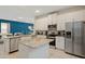 Bright kitchen with stainless steel appliances, granite countertops, ample storage, and breakfast island at 385 Southfield St, Kissimmee, FL 34747