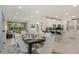 Open-concept living space with an airy dining area, breakfast bar and a seamless flow to the outdoor space at 385 Southfield St, Kissimmee, FL 34747