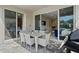 Outdoor patio featuring a dining table with six chairs and a grill perfect for entertaining guests at 385 Southfield St, Kissimmee, FL 34747