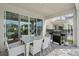 Outdoor patio featuring a dining table with six chairs and a grill perfect for entertaining guests at 385 Southfield St, Kissimmee, FL 34747