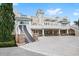 Two-story building with a restaurant and outdoor seating, surrounded by lush landscaping at 385 Southfield St, Kissimmee, FL 34747