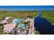 Aerial view showcases the community's multiple pools, cabanas, palm trees, and waterfront access at 3920 Reed Grass Pl, Kissimmee, FL 34746