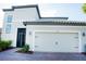 Charming home with a two-car garage and decorative hardware, number 3920, and beautiful landscaping at 3920 Reed Grass Pl, Kissimmee, FL 34746