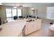 Kitchen with quartz countertops, stainless steel dishwasher, and open view to the living room at 3920 Reed Grass Pl, Kissimmee, FL 34746