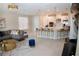Open living area with kitchen, breakfast bar, and stylish gold accents at 3920 Reed Grass Pl, Kissimmee, FL 34746