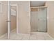 Bathroom with tiled floors, a shower with sliding doors and a door way at 502 Woodland Creek Blvd, Kissimmee, FL 34744