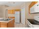 Kitchen featuring tile flooring and an electric range stove at 502 Woodland Creek Blvd, Kissimmee, FL 34744
