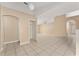 Open living room with multiple archways and neutral walls and tile flooring at 502 Woodland Creek Blvd, Kissimmee, FL 34744