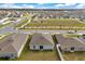 Aerial view of backyards featuring grass and privacy fences close to a neighborhood park at 541 Jerry Ln, Haines City, FL 33844