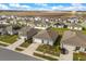 Aerial view of homes with solar panels and well-kept lawns in a neighborhood under development at 541 Jerry Ln, Haines City, FL 33844