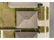 Birds-eye view of a home featuring a well maintained roof, green lawn, and a paved driveway with parking at 541 Jerry Ln, Haines City, FL 33844