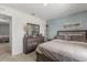 Comfortable bedroom with grey-scale decor, a vanity, and neutral walls at 541 Jerry Ln, Haines City, FL 33844