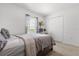 Bright bedroom with a comfortable bed, large window with sheers, and a closet at 541 Jerry Ln, Haines City, FL 33844