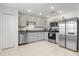 Well-equipped kitchen with stainless steel appliances, granite countertops, modern cabinetry, and ample workspace at 541 Jerry Ln, Haines City, FL 33844