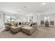Spacious living room open to the dining area, featuring comfortable seating and plenty of natural light at 541 Jerry Ln, Haines City, FL 33844