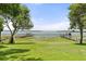 Expansive backyard featuring waterfront with private dock, surrounded by mature trees at 6100 Alligator Lake W Shr, St Cloud, FL 34771