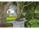 Outdoor cooking area with built-in grill, perfect for enjoying outdoor meals by the water at 6100 Alligator Lake W Shr, St Cloud, FL 34771