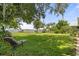 Lush backyard with lake view, dock, and mature trees creating a serene, outdoor space at 6100 Alligator Lake W Shr, St Cloud, FL 34771