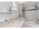 Updated bathroom features granite countertop, glass bowl sink, tiled shower with decorative accent tiles at 6100 Alligator Lake W Shr, St Cloud, FL 34771