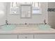 Bathroom with dual vessel sinks, granite countertop, and mosaic tile backsplash at 6100 Alligator Lake W Shr, St Cloud, FL 34771