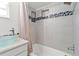 Bathroom showcasing a vessel sink, granite countertop, and a shower with decorative tile at 6100 Alligator Lake W Shr, St Cloud, FL 34771