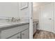 This bathroom features granite countertops, new cabinets and new wood-look tile floor at 6100 Alligator Lake W Shr, St Cloud, FL 34771