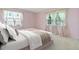 Bedroom featuring neutral tones, lots of natural light, carpet and ample closet space at 6100 Alligator Lake W Shr, St Cloud, FL 34771