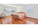 Bright bedroom showcasing hardwood floors and lots of natural light from large windows at 6100 Alligator Lake W Shr, St Cloud, FL 34771