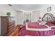 Bedroom showcasing hardwood floors, traditional furniture and ample natural light from a window at 6100 Alligator Lake W Shr, St Cloud, FL 34771