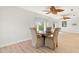 Cozy breakfast nook with a round table, natural lighting, and ceiling fans at 6100 Alligator Lake W Shr, St Cloud, FL 34771