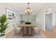Bright dining area with new floors, chandelier, and large dining table at 6100 Alligator Lake W Shr, St Cloud, FL 34771