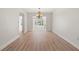 Open dining area featuring new floors and an elegant chandelier at 6100 Alligator Lake W Shr, St Cloud, FL 34771