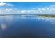 Expansive lake view with clear blue skies and calm waters, showcasing a serene and picturesque landscape at 6100 Alligator Lake W Shr, St Cloud, FL 34771